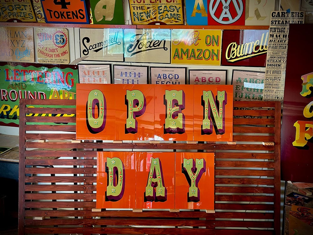 Hand painted letters by Joby Carter saying Open Day