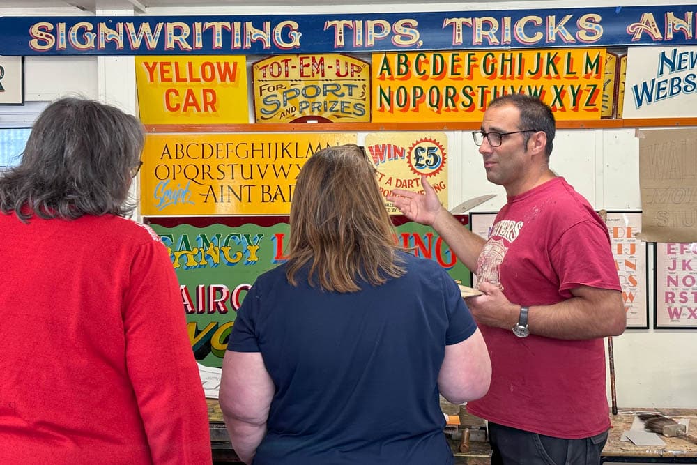 Joby Carter teaching signwriting