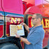 Joby Carter hand painted letter Bonnet Side, pictured next to a vintage vehicle