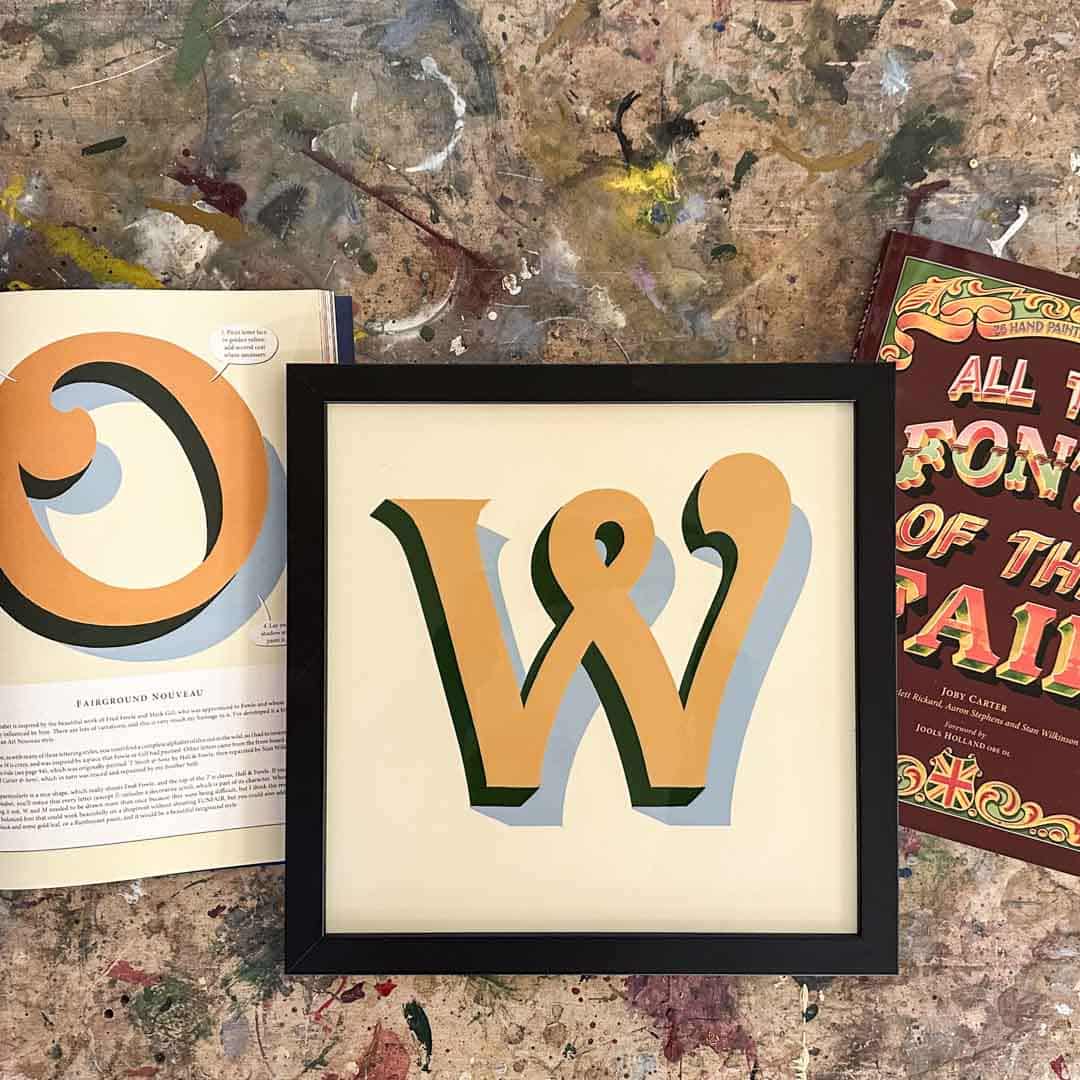 Joby Carter fairground nouveau with the pages of the book All the Fonts of the Fair.