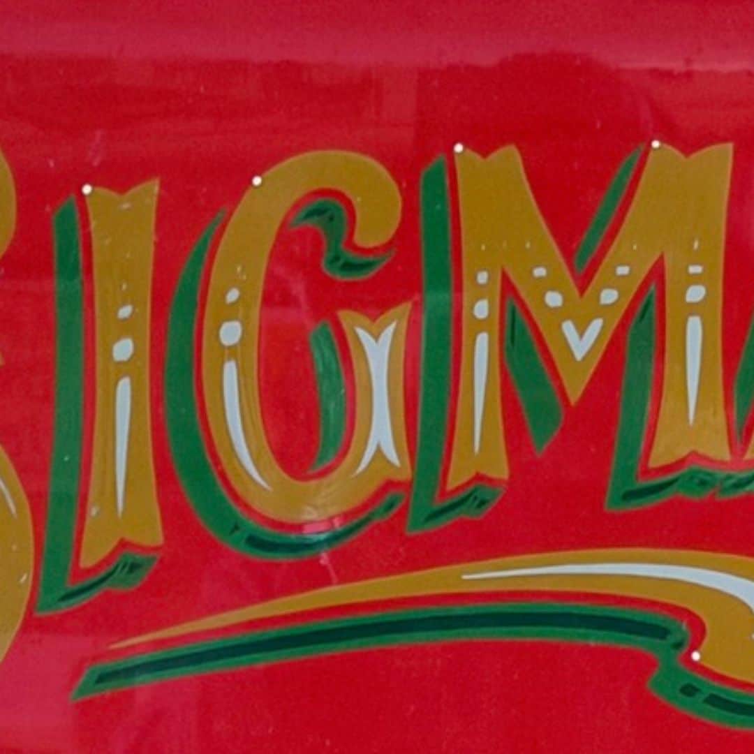 Close up of handprinted Sigma sign