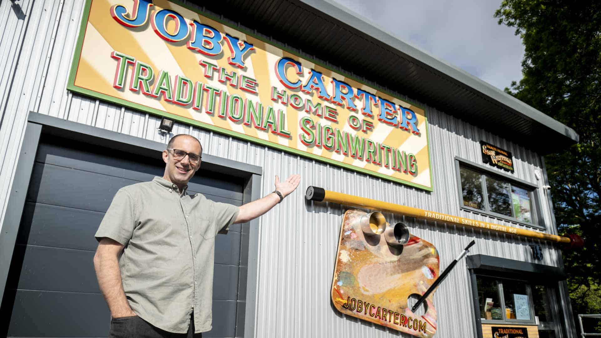 Joby Carter outside his workshop the home of traditional signwriting
