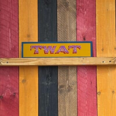 Hand Painted TWAT sign, yellow and pink