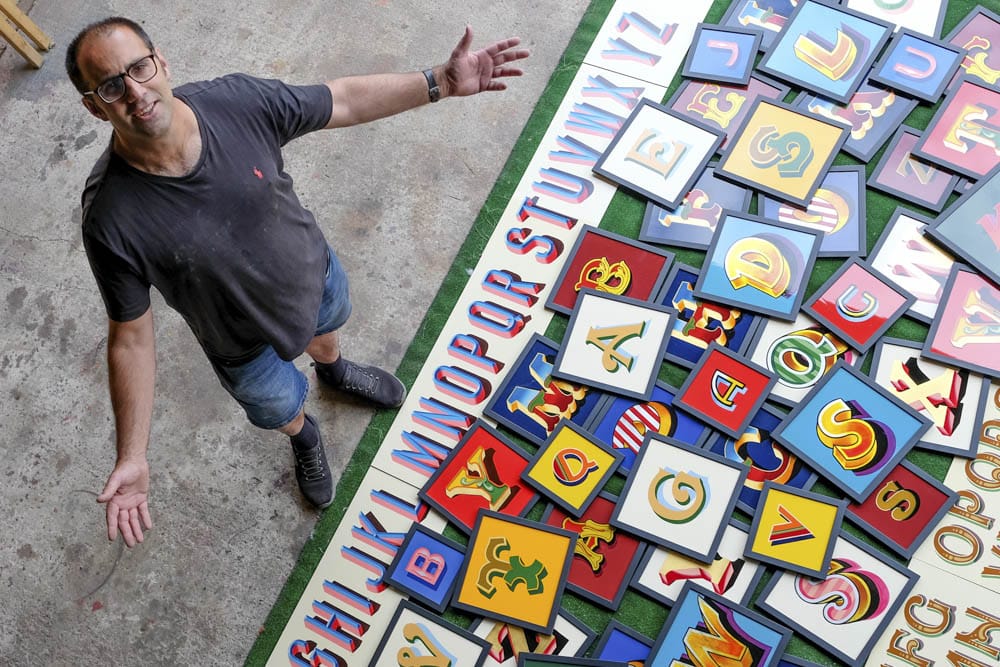 Joby Carter with letters from all the fonts of the fair